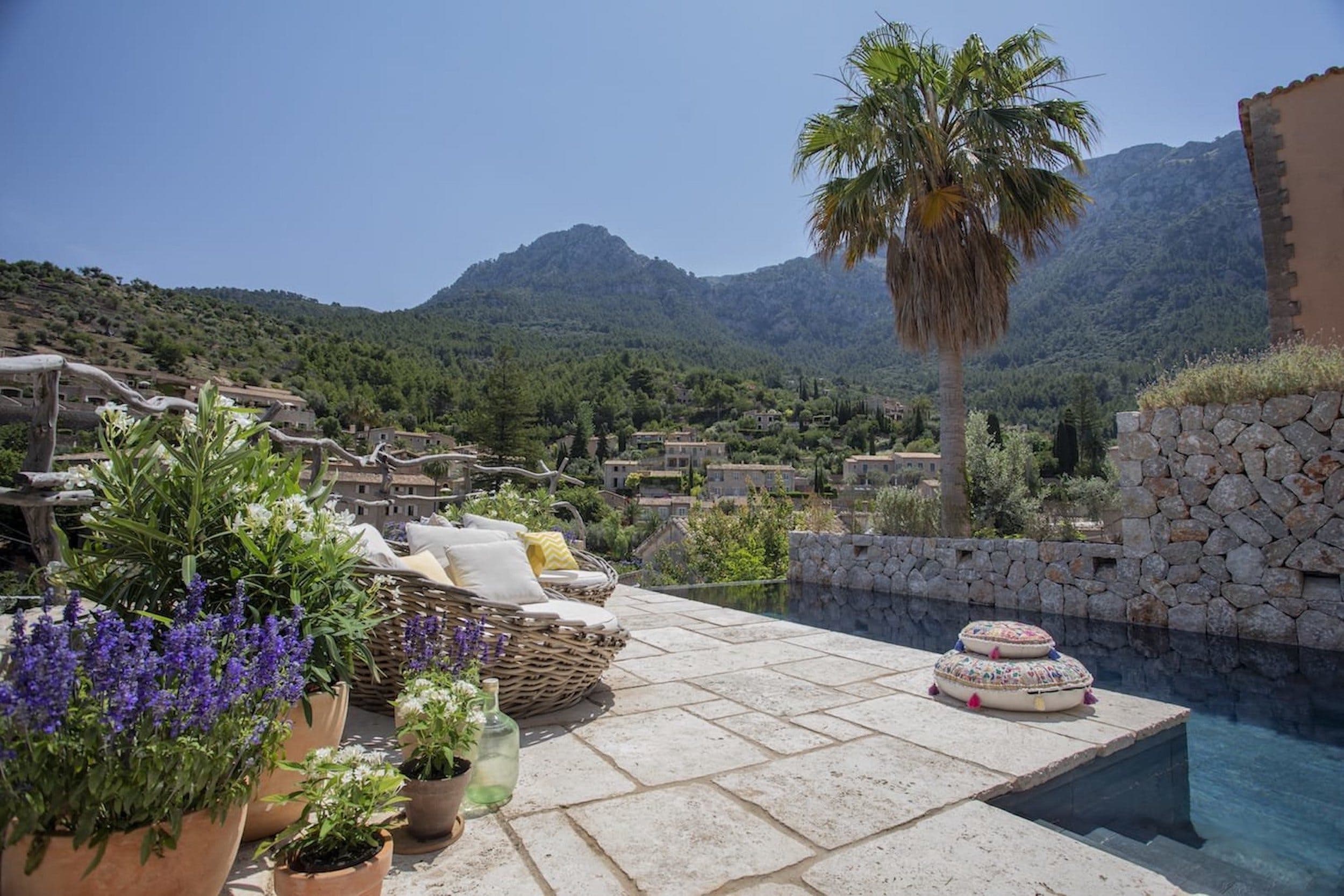 Mallorca tourist tax: the pool of a finca in Deià looking out towards the Tramuntana mountains.
